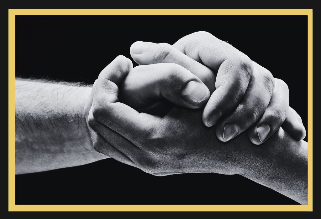 One person helping another up, symbolising support and safety under domestic violence law Sydney with guidance from a family lawyer domestic violence specialist and structured supervised contact.