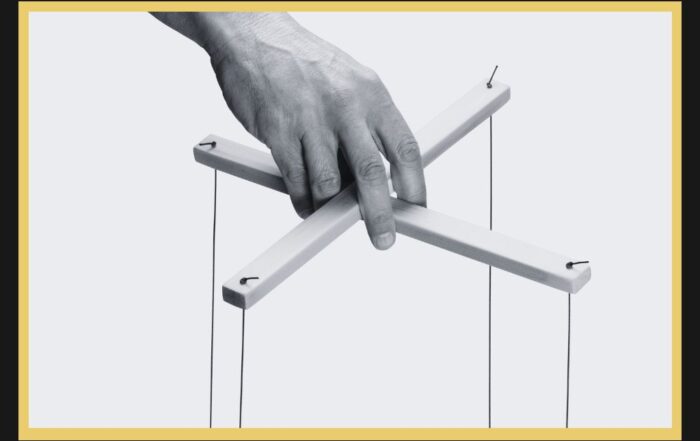Hand controlling puppet strings representing coercive control and litigation abuse in family law proceedings.