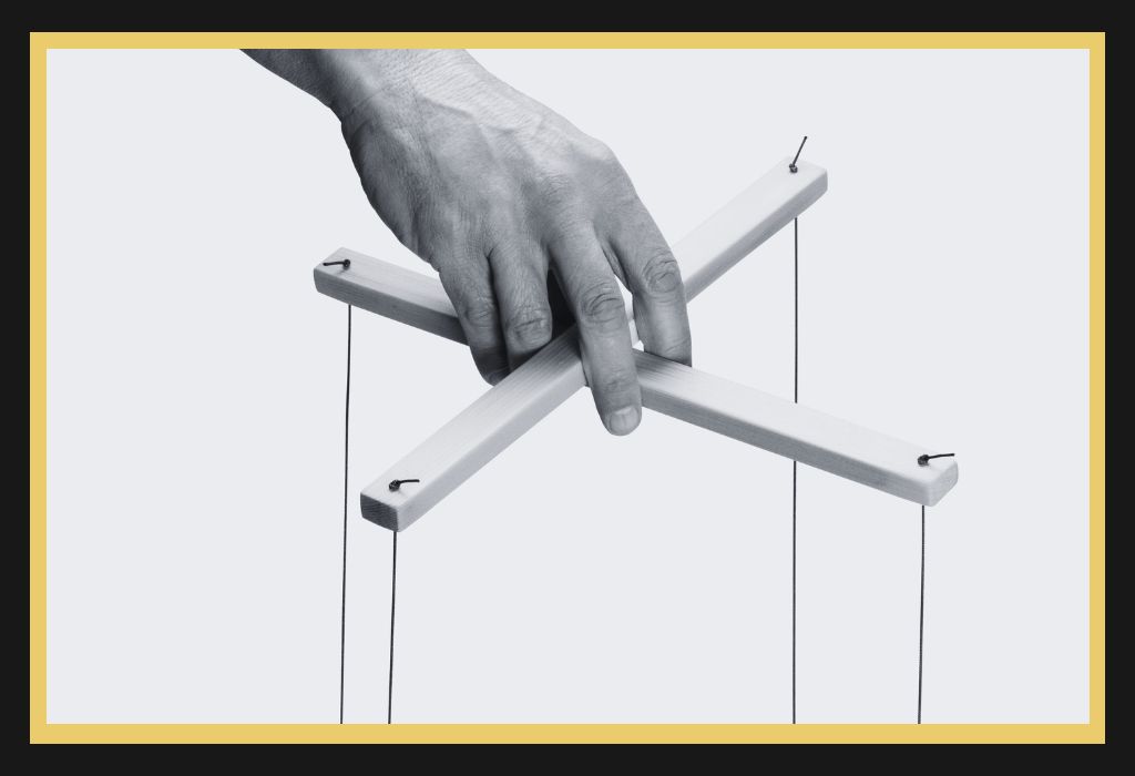 Hand controlling puppet strings representing coercive control and litigation abuse in family law proceedings.